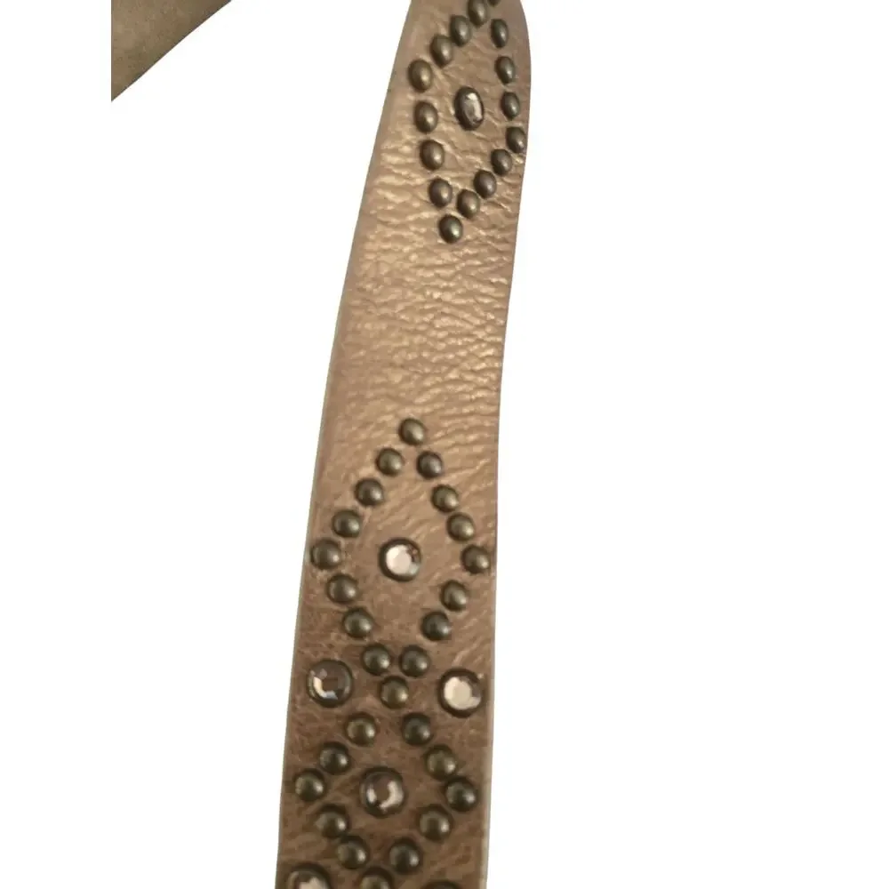 Vintage Leatherock studded belt with cross buckle.